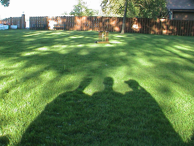 Craig, Dan and Tammy survey the croquet pitch.