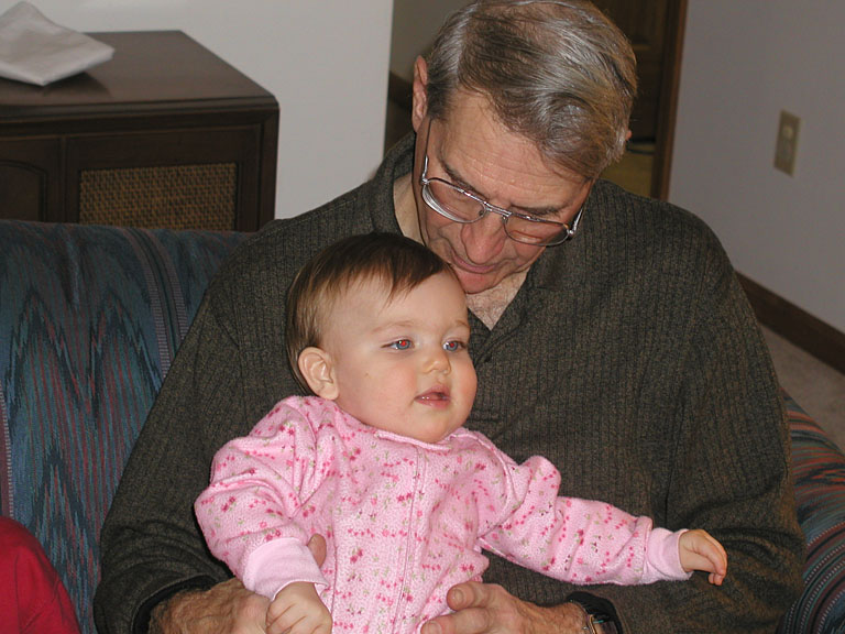 Dad holding Sarah.