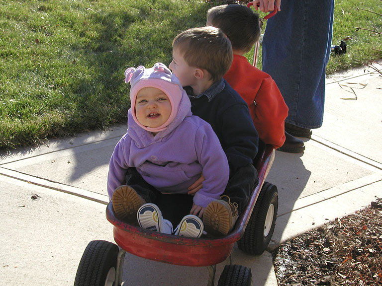 Sarah, Joel and Todd get pulled in the red wagon.