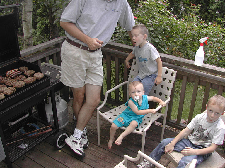 The boys are in charge of grilling the meat: Craig, Seth, Todd, and Joel.