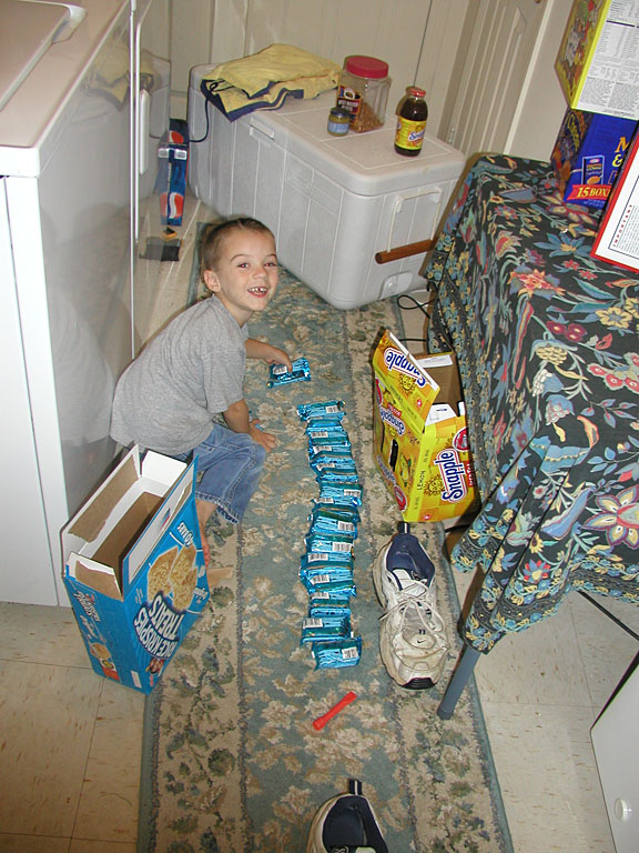 Todd counts the rice crispy treats to make sure they are all there.