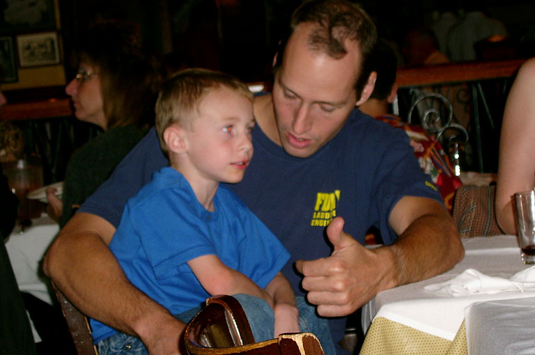 Nelson tells Joel a story while we wait for dinner in Times Square.
