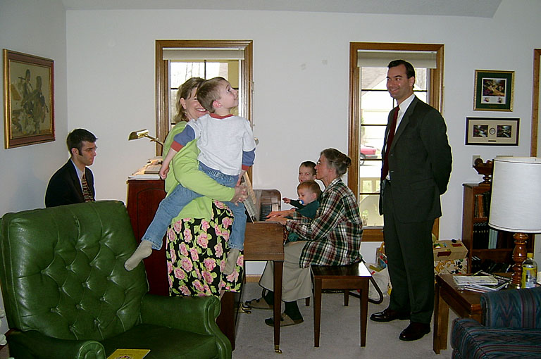 Jodie plays with Joel, while Alan looks on. Dan and Mom play the piano while Mom gets a little help from Seth and Todd.