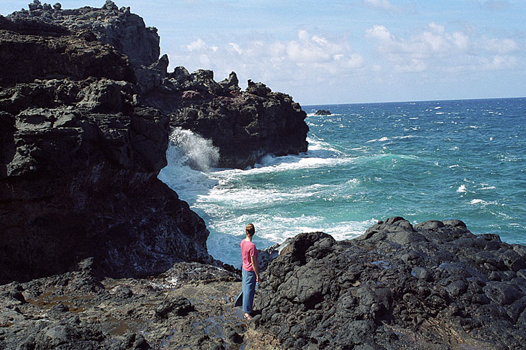 Laurie almost seems to be engulfed by the large waves.