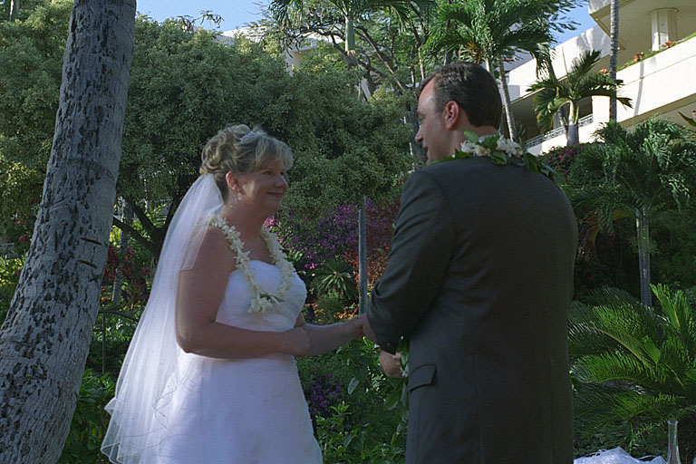Alan gently puts Jodie's wwedding ring on her finger.