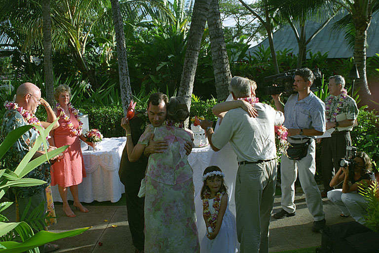 Jodie and Alan hug Mom and Dad.