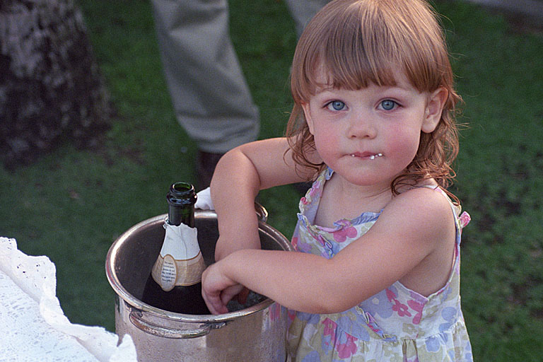 Sarah washes her hands off in the wine chiller ice water.