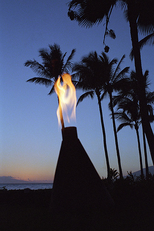 Hawaiian tiki torch at sunset.