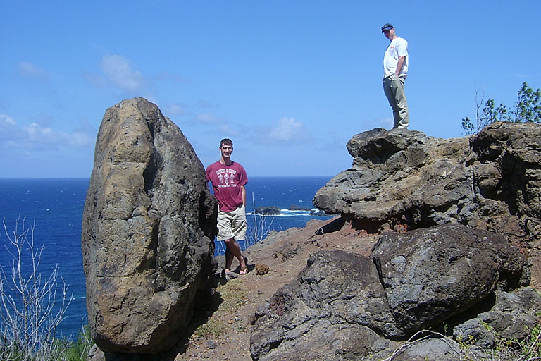 Dan and Chad posing by a huge rock.