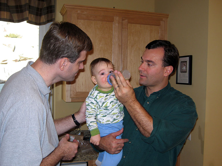 Craig and Alan feed Michael.