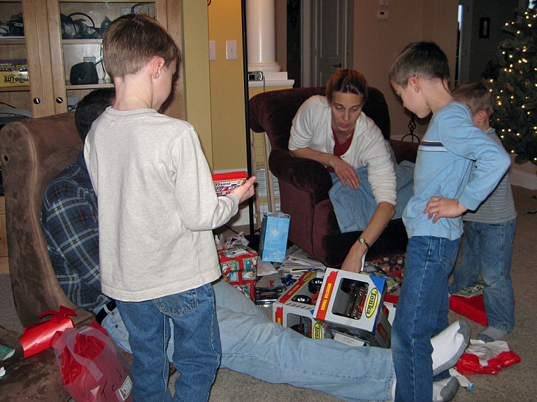 Joe, Chad, Laurie, Todd, and Seth survey the boy's loot.
