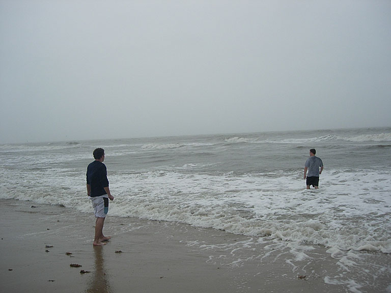 Jon wonders why Nick is going out into the water on such a rainy and cold day.