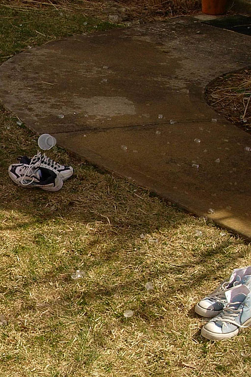 Ice, cups, and wet shoes are evidence of the water fight.