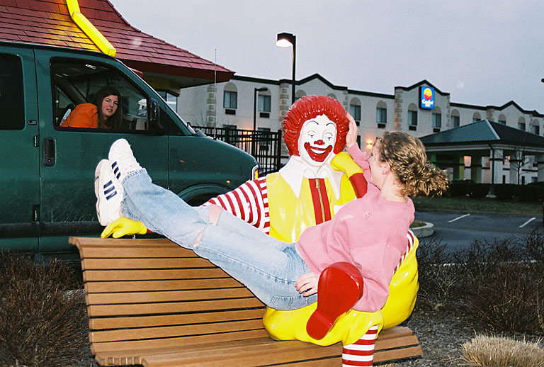 Kristi plays with Ronald's locks while Kami shows a face of disgust.