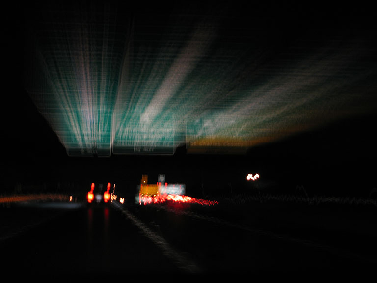 The sign for our turn goes streaking by, unnoticed, in a blur.