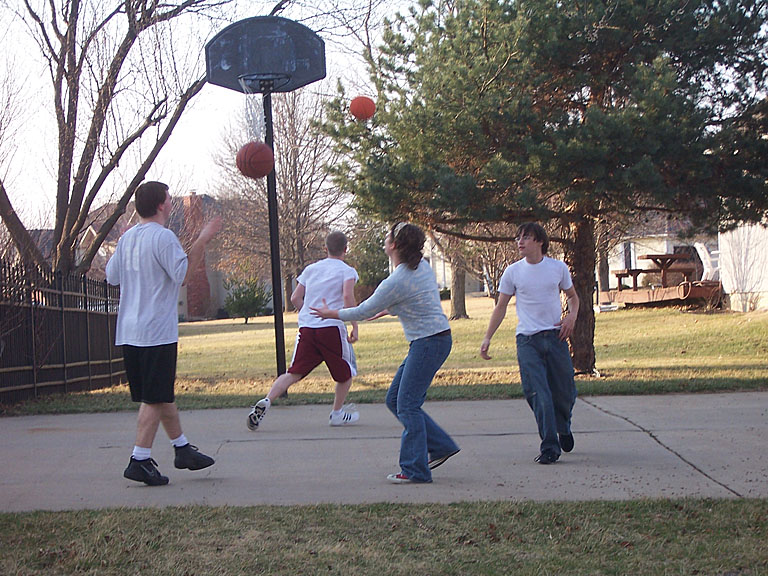 Michael, Jeremy, Katy, and Jon Peake play a little basketball.