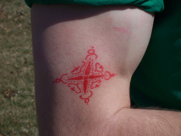 Mark's tat is deformed by his massive muscles.