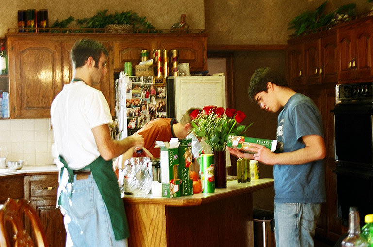 Dan and Kyle start cooking the lasagna noodles.