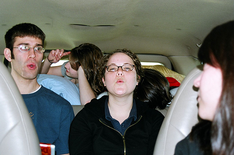 Dan desperately tries to teach Katy how to whistle.  No dice.