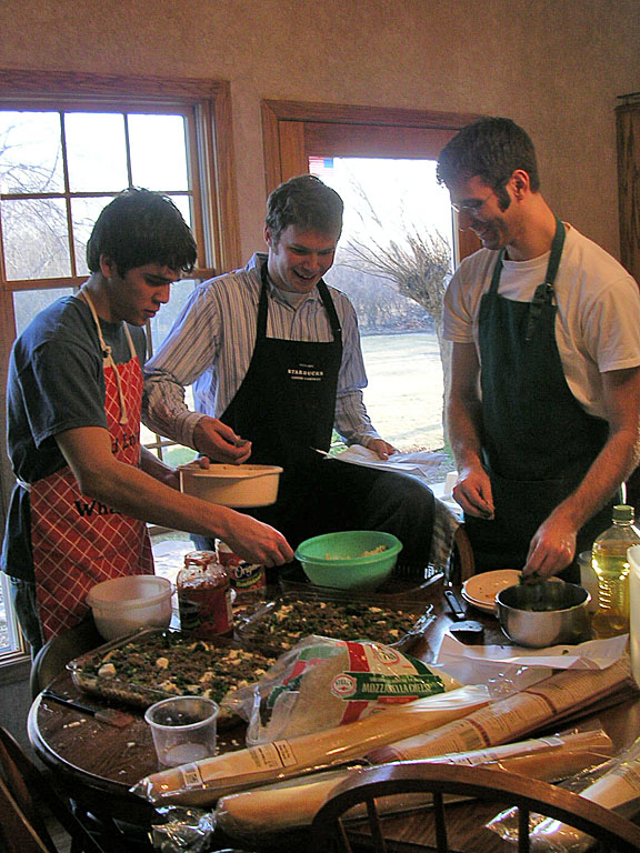 Kyle adds the meat, Mark adds the cheese, and Dan adds the spices.