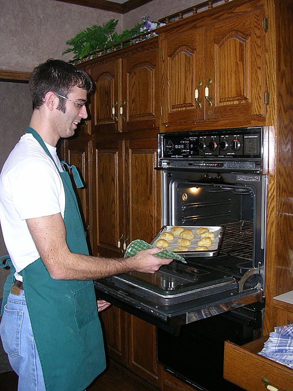 Dan pulls golden perfection out of the oven.