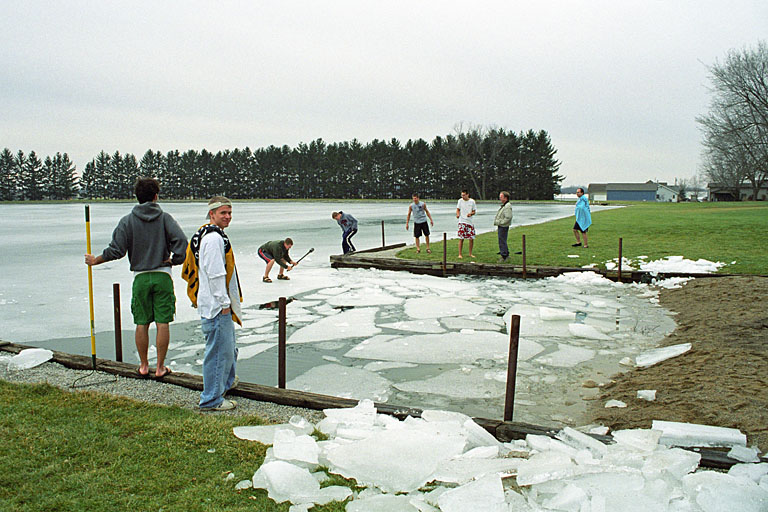 Jeremy watches the guys break up the ice so we can go swimming.