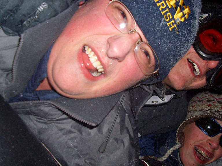 Andrew Fischer, Zachary Schumacher, and Andrew Schlatter pile on for the ride.