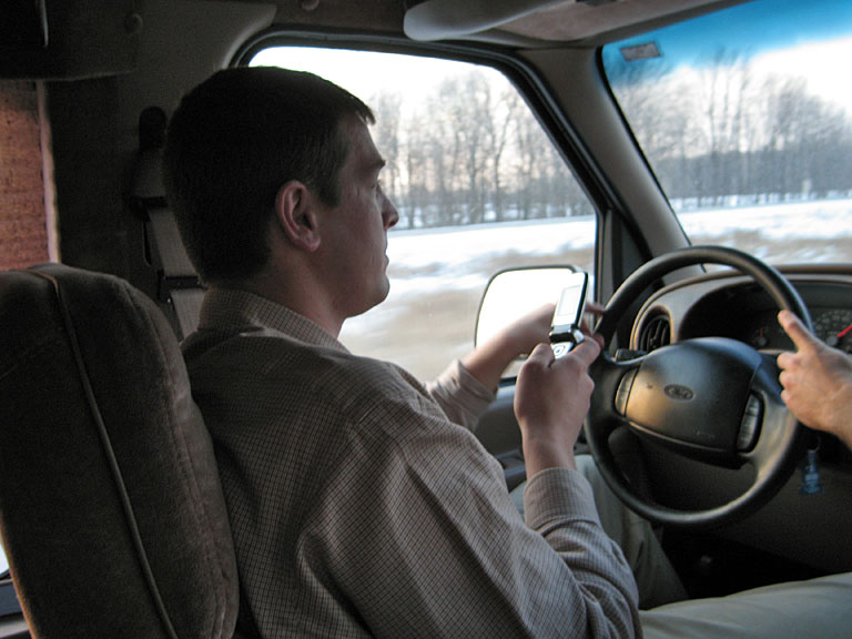 Jason Klopfenstein takes another phone call while Dan takes the wheel.  Safety first kids.
