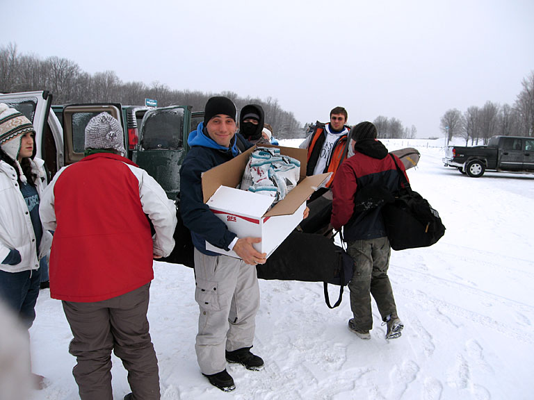Unloading the vans.  Let's go skiing.  Jon, just don't drop the food.