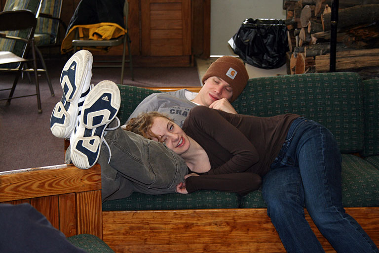 Jeremy and Kristi Reinhard relax in front of the fire.