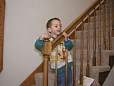 Todd hangs onto the stairway railing.