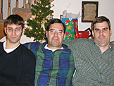 Dan, Alan and Craig act discusted because they have to pose for another picture.