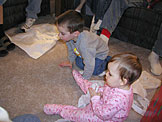 Todd and Sarah play on the floor.