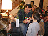 Alan shows Madeline and Todd how Madeline's gumball machine works.