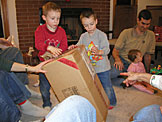 Joel and Todd get ready to tear into the big box.