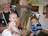 Aunt Sheryl hold Sarah, while Mom holds her newest grandson Seth.