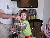 Madeline takes the applesauce machine for a spin.  She can almost taste the goodness.
