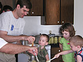 Craig keeps me machine filled with apples while Todd cranks away.  Madeline and Joel run quality control.