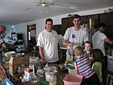 Dad, Alan, Craig, Joel, Todd, Madeline and Dan work hard because they know how good home-made applesauce tastes.