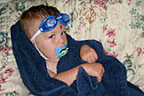 Little Seth rests a little after some hard swimming.