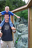 Joel rides on Dan's shoulders through the Central Park Zoo polar bear exhibit.