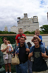 Craig, Alan and Dan give rides to Sarah, Todd, and Joel at the Central Park Zoo.