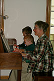 Mom getting a little help from the young musicians Seth and Todd.