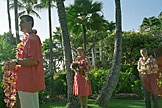 Craig waits with a armful of leis.