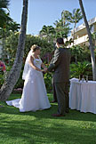 Alan and Jodie hold hands and look at the minister.