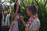 Sarah blows bubbles as Laurie holds the hoop.