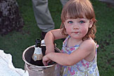 Sarah washes her hands off in the wine chiller ice water.