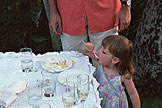 Sarah helps herself to wome wedding cake.