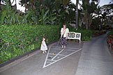 Tammy teaches Sarah how to play shuffleboard.