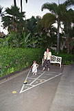 Sarah tries her hand st shuffleboard while Tammy watches.
